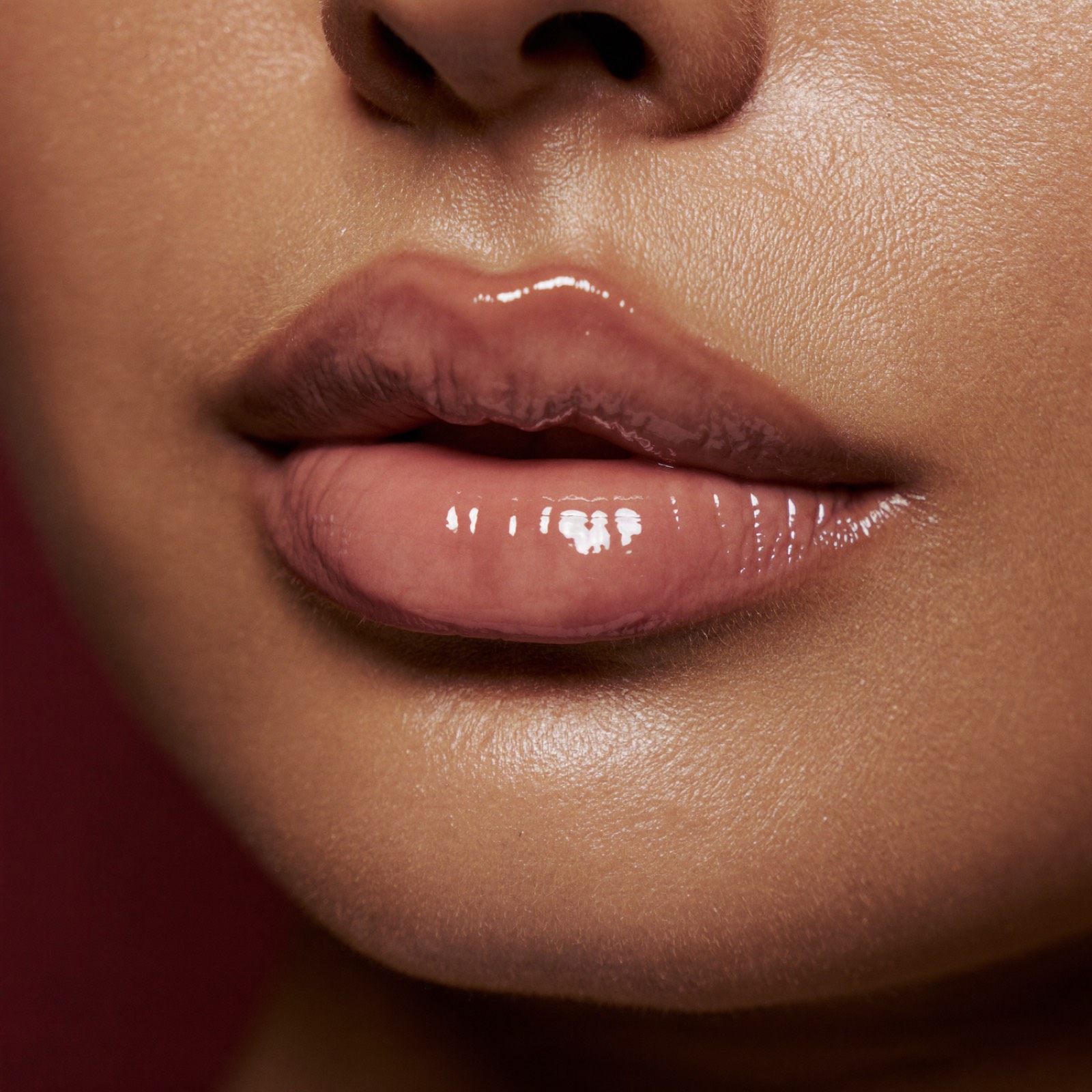 Extreme close-up of glossy, naturally full lips