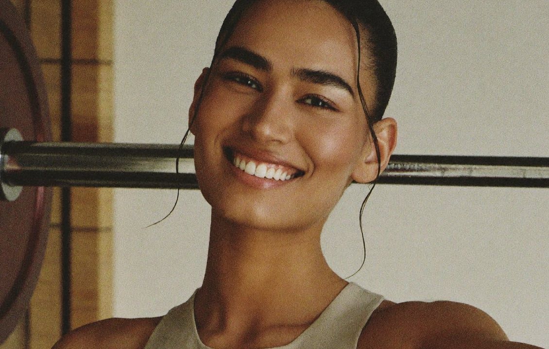 Portrait of Imogen Lane smiling in the gym