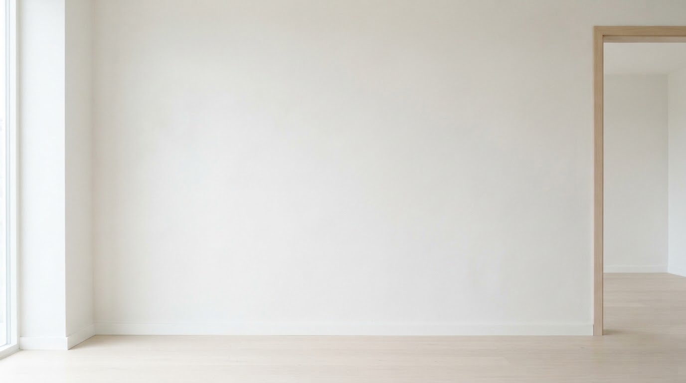 Decorator rolling fresh paint onto a wall